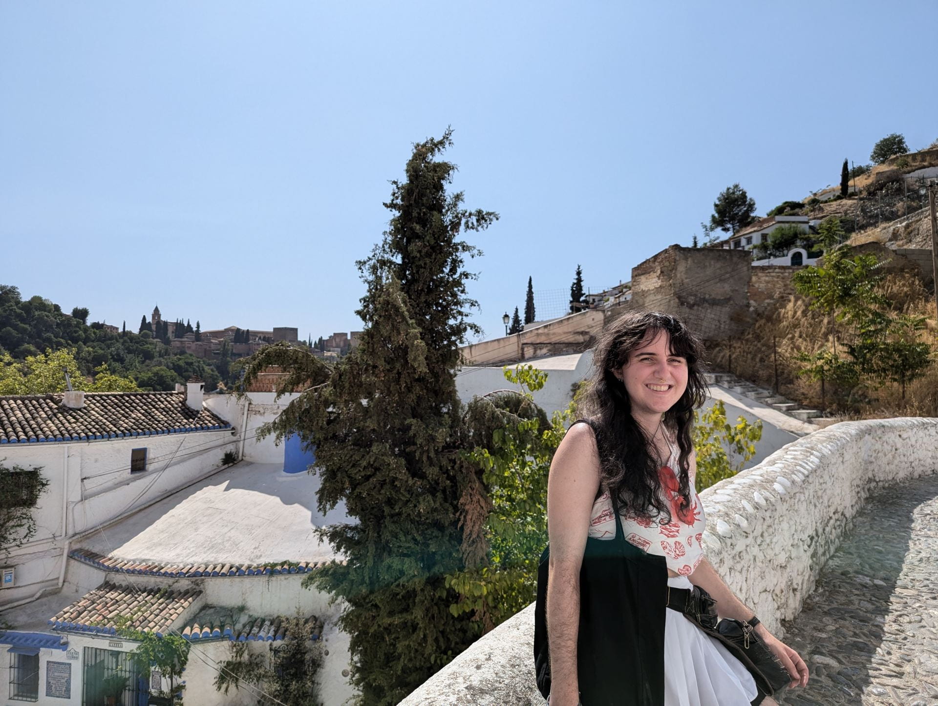 Young person posing on a Greek island in the sun.