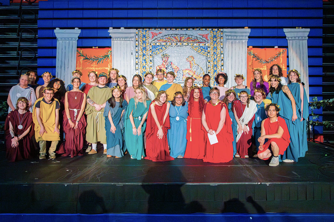 Students dressed in himations for a Roman inspired Convivium