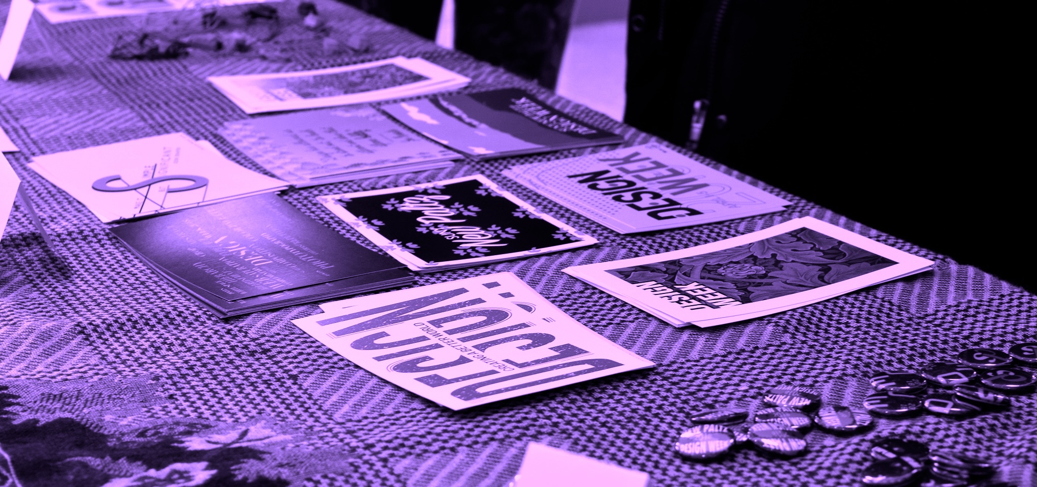 postcards and buttons on a table