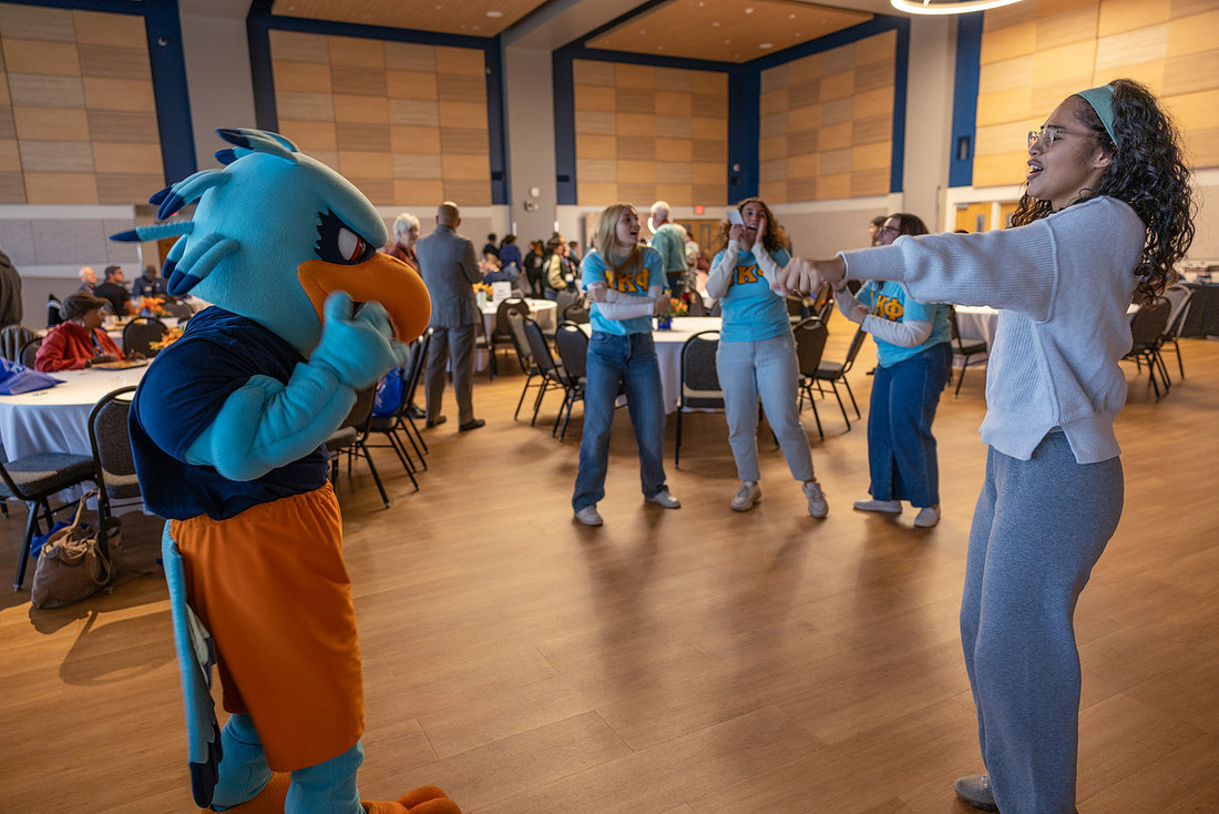 Hugo the Hawk dances around the Ballroom.