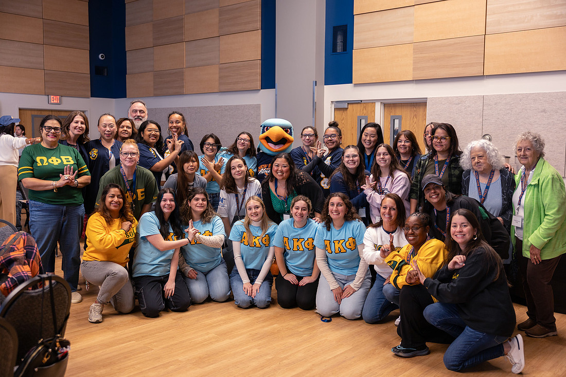 Group poses at luncheon.