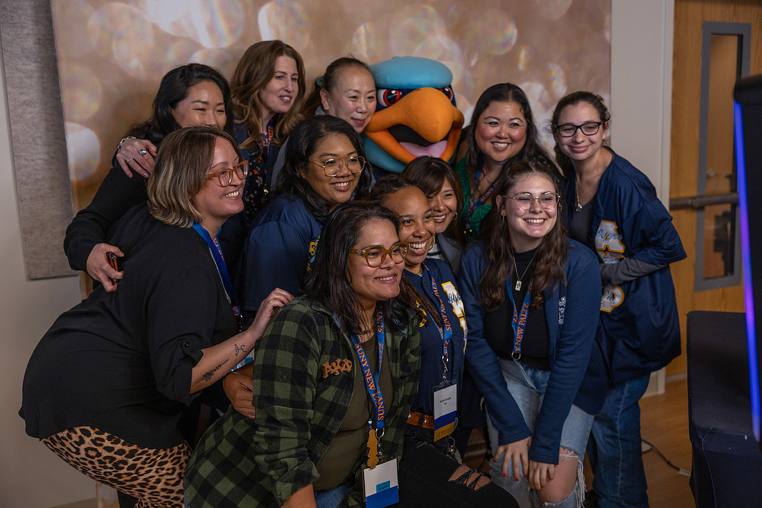 Alumni gather for a photobooth image