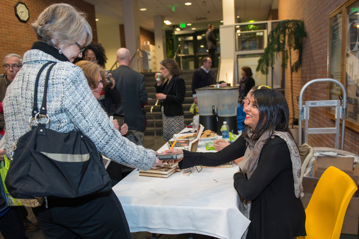 Ottaway shaking students hand