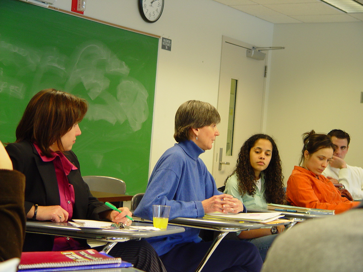 Students sitting at desks listening to Ottaway