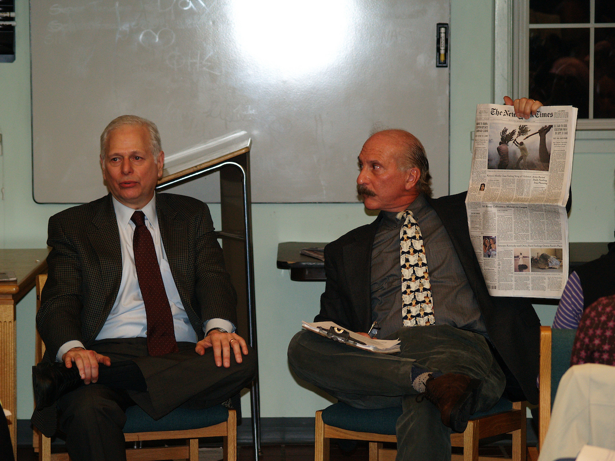 Ottaway and Rob holding up a newspaper
