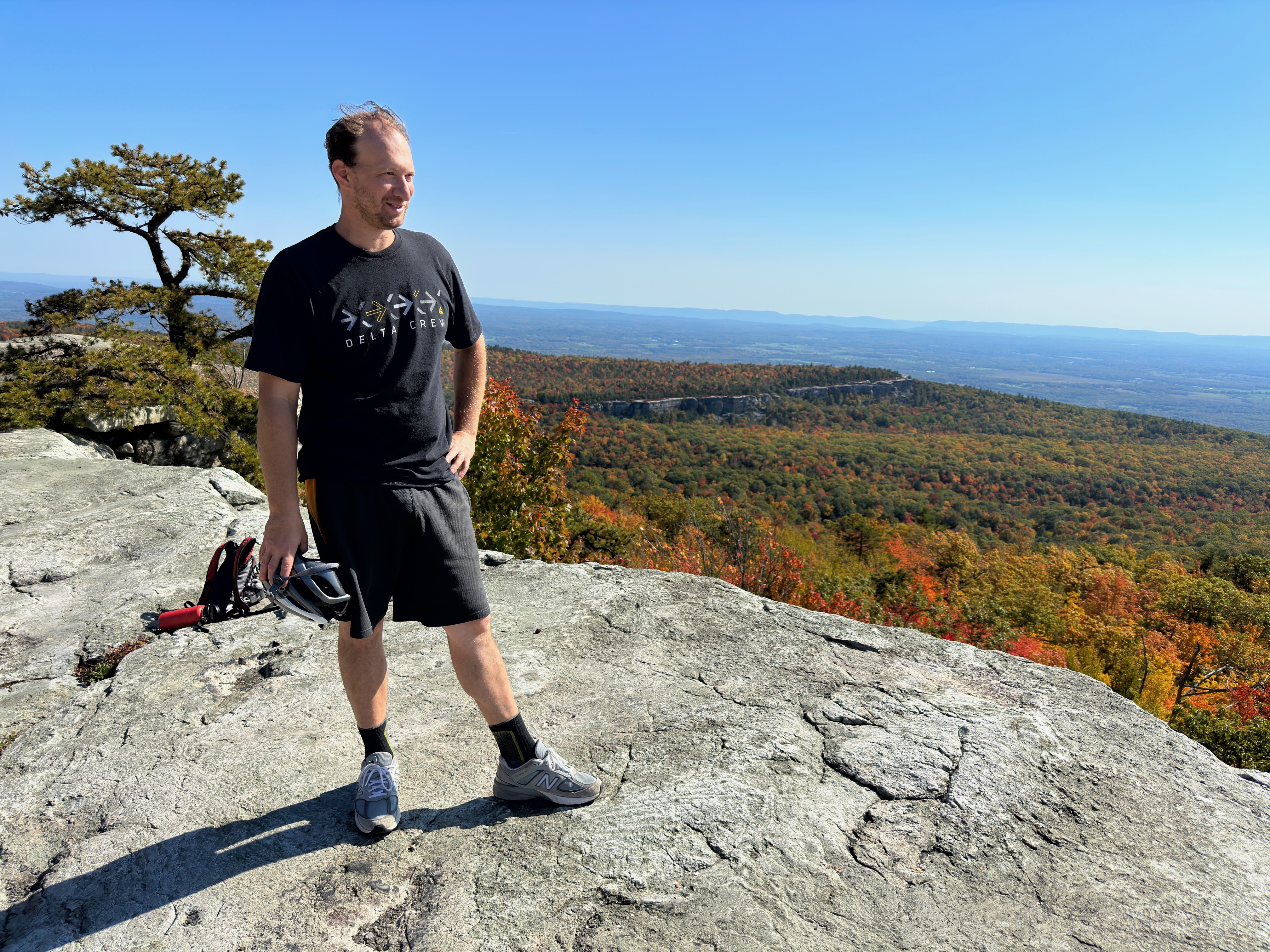 Alumnus looking proudly hiking on Shawangunk Ridge