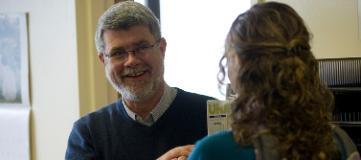 Student and professor speaking with each other